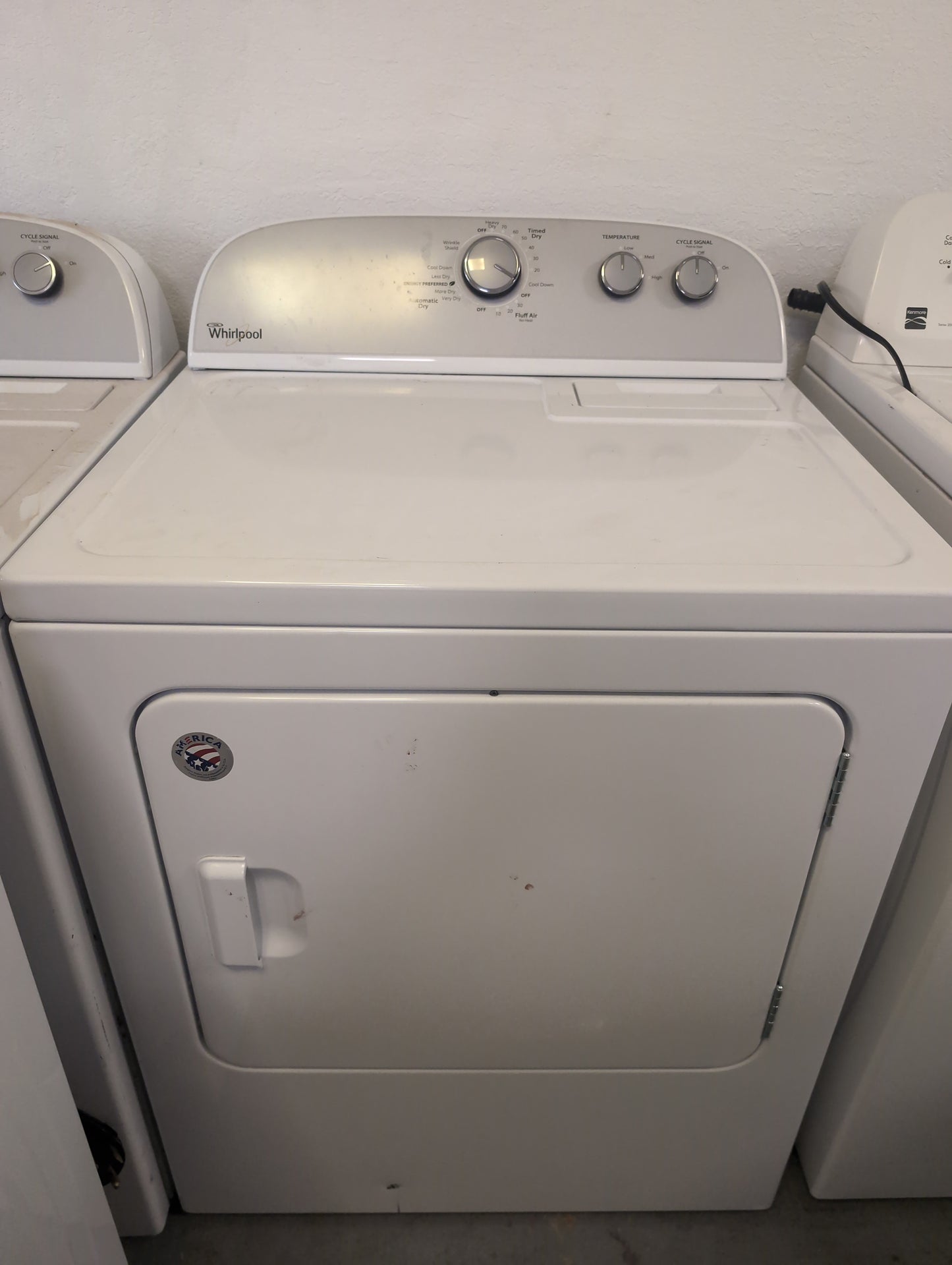 Used Whirlpool 3.5 cubic foot top load washer with agitator and 7 cubic foot electric dryer set.