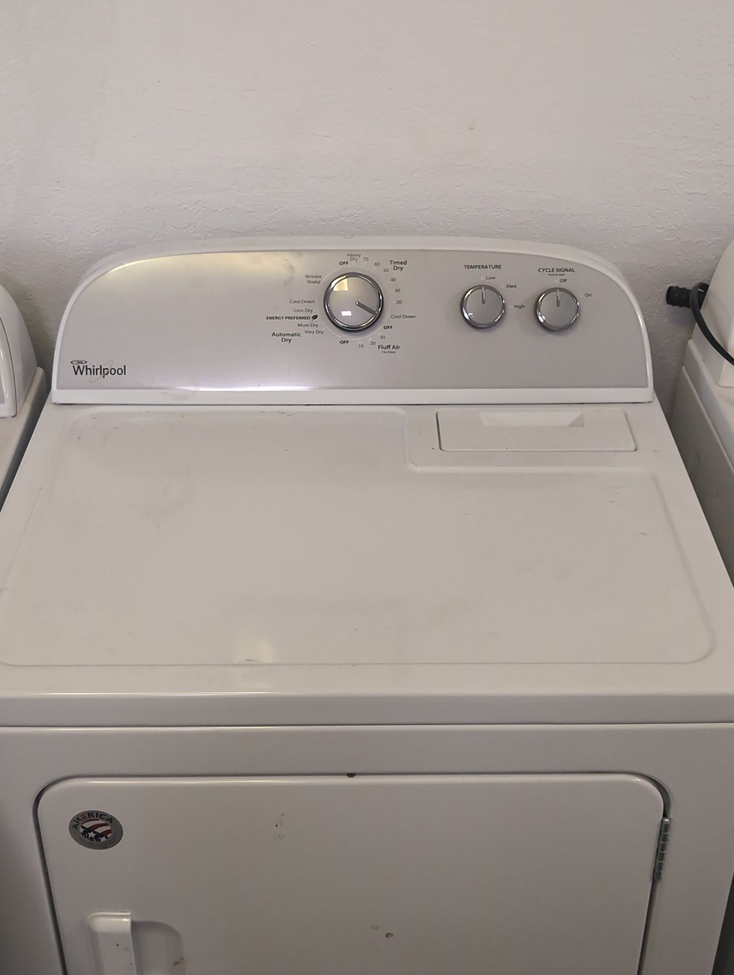 Used Whirlpool 3.5 cubic foot top load washer with agitator and 7 cubic foot electric dryer set.