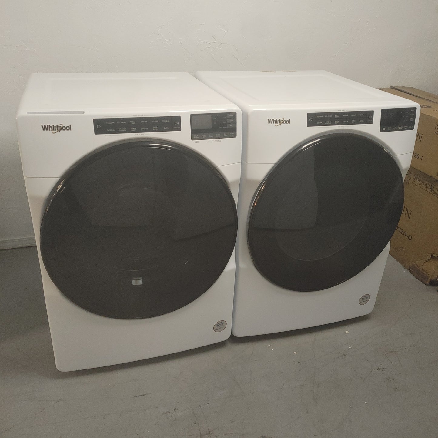 New Whirlpool 4.5 cubic ft Front Load Washer and 7.4 cubic ft stackable Electric Dryer Set