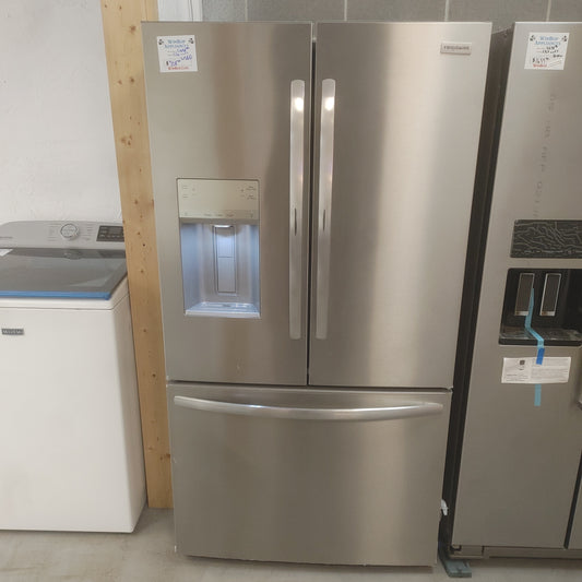 Used Frigidaire 27.8 cubic foot stainless French door refrigerator with ice and water in the door. Scratched handles