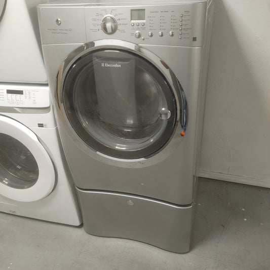 Used Electrolux 4.33 ft front load washer. Gray. With pedestal