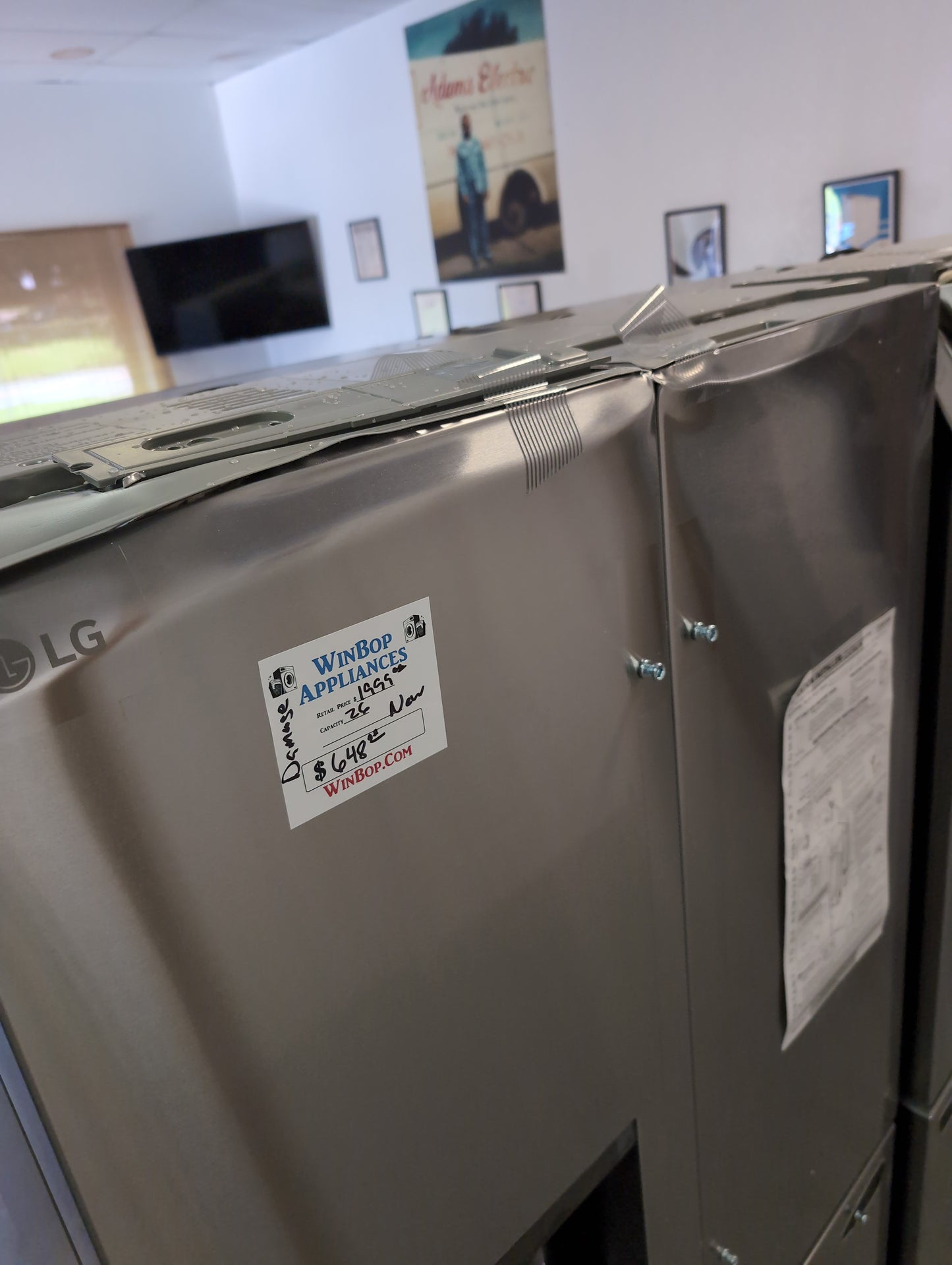 New LG counter depth 26 cubic foot stainless steel French door refrigerator with ice and water in the door. Door Damage