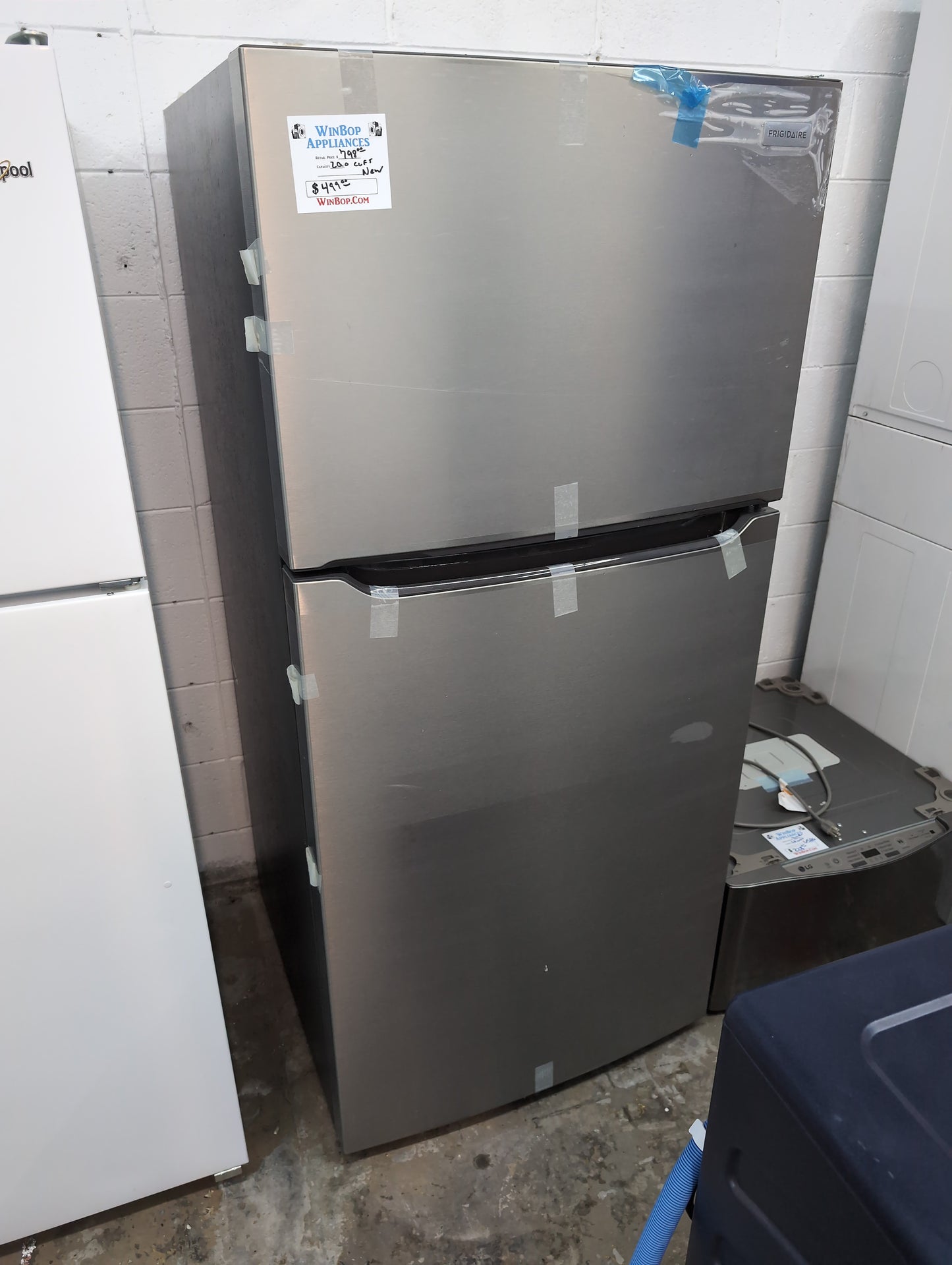 New Frigidaire 20 cubic foot top freezer refrigerator stainless