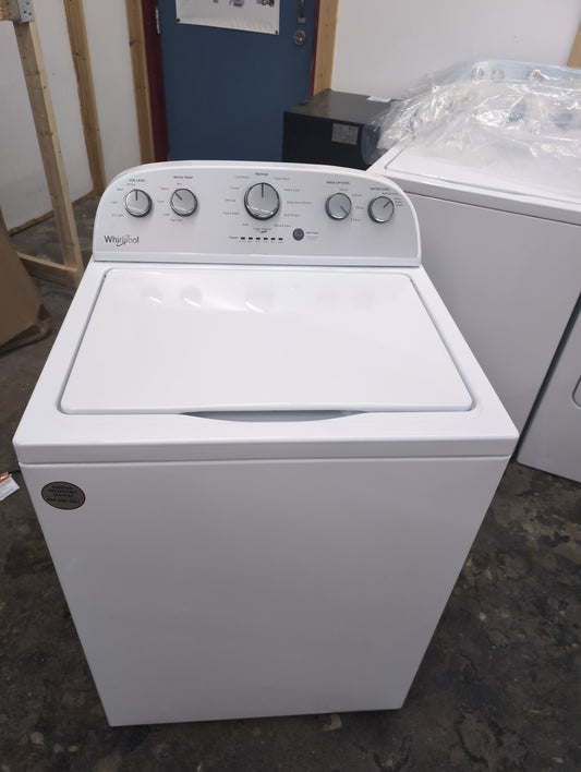 Used Whirlpool 3.5 cubic foot top load washer with agitator and 7 cubic foot electric dryer set.