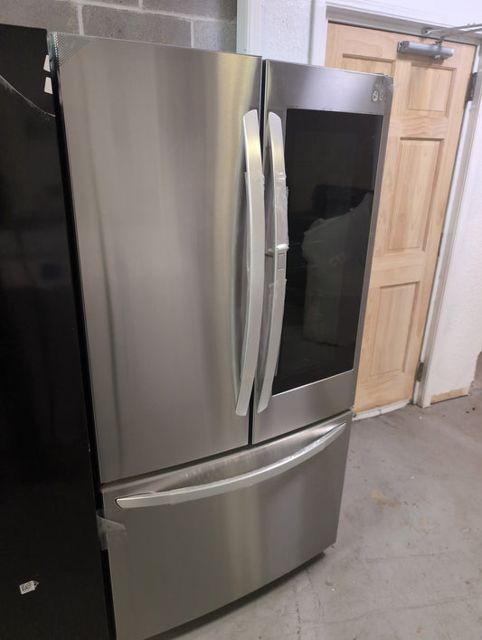 New LG Stainless 3 Door InstaView Refrigerator. Dent in top right corner